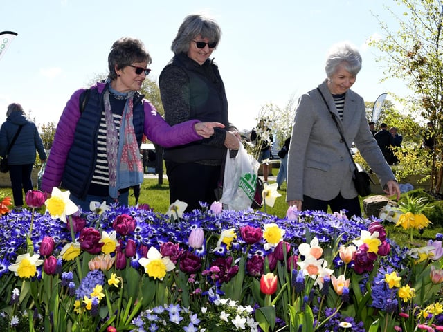Visitors enjoying the beautiful flowers on display in the sunshine at the Great Yorkshire Showground