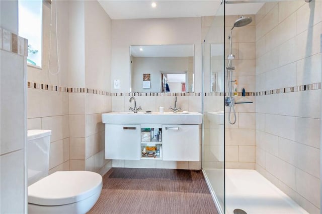 Along with the traditional family bathroom is this modern shower room.