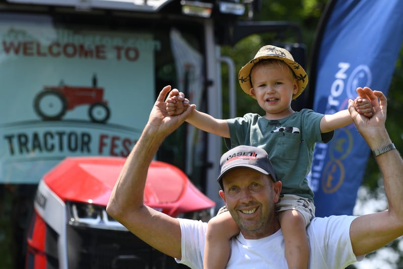 Henry Williams (aged two) with his grandad Ian Walden enjoying the festival in the sunshine at Newby Hall