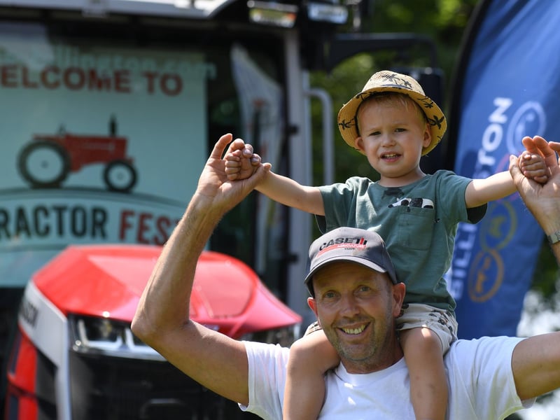 Henry Williams (aged two) with his grandad Ian Walden enjoying the festival in the sunshine at Newby Hall