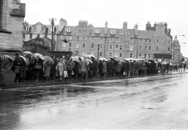 Old age pensioners queue for free butter and cheese from the EEC 'butter mountain' at South Side community centre in Edinburgh, March 1987.