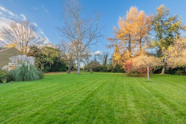 Beautiful landscaped gardens are extensive, with patio seating areas and a terrace.