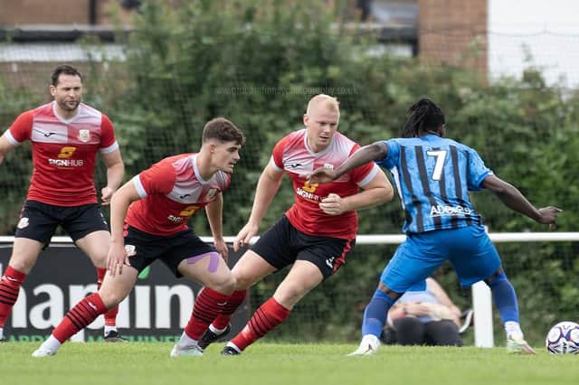 The Knaresborough Town defence works hard to shut down a shooting opportunity for Horbury Town's Sam Kyeremeh. Picture: Graham Finney Photography