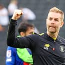 Harrogate Town manager Simon Weaver celebrates Saturday's 1-0 League Two win at MK Dons. Pictures: Matt Kirkham