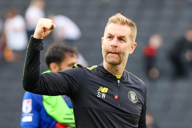 Harrogate Town manager Simon Weaver celebrates Saturday's 1-0 League Two win at MK Dons. Pictures: Matt Kirkham