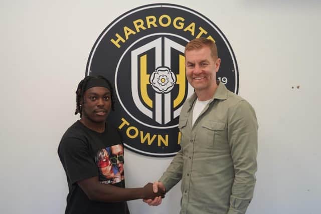 Abraham Odoh is welcomed to Wetherby Road by Simon Weaver. Picture: Harrogate Town AFC