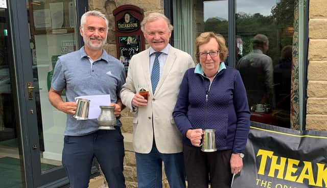 Masham Golf Club Theakston’s Cup winners, Tim Howard and Alison Sayer with Simon Theakston.