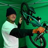 Steve Shearsby of Resurrection Bikes fixing a donated bike