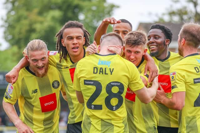 Harrogate Town players celebrate taking a two-goal lead in last season's opening-day victory over Swindon.