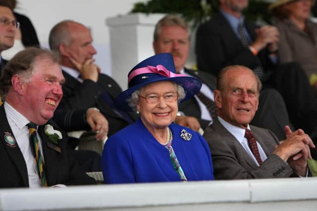 Bill Cowling pictured with the Queen and the Duke of Edinburgh