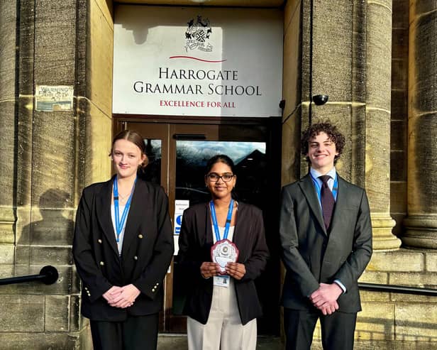 Left to right: Sophie, Swetha and Brando from Year 12 with their regional trophy.