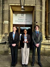 Left to right: Sophie, Swetha and Brando from Year 12 with their regional trophy.