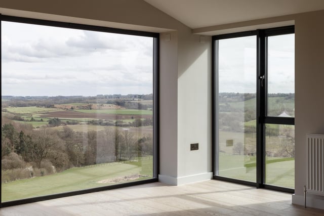 Large windows showcase valley views that stretch for miles.