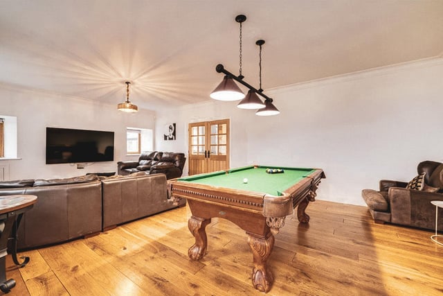 The property boasts additional living areas with space for recreational games.