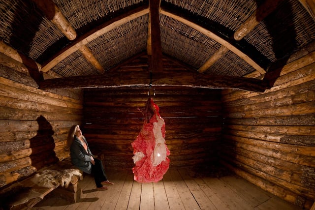 Sasha Jackson-Brown pictured with the sculpture called 'Cocoon' by Caroline Pick