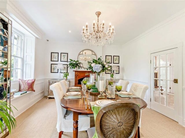 The dining room has a large window with a charming window seat.