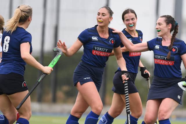 Harriet Evans is congratulated by her Harrogate Hockey Club Ladies 1s team-mates after netting a second-half equaliser against Brooklands Poynton. Pictures: Gerard Binks