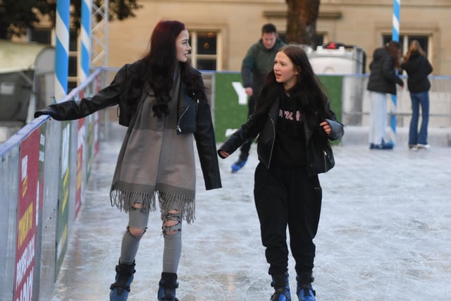 Visitors to the Christmas Fayre enjoying the outdoor ice rink which can be found in the Crescent Gardens