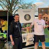 Supporting charity - Jeff Walker of Up & Running Harrogate, right; and David, Harrogate store manager, left; in present the socks to David Thomas from the Harrogate Homeless Project.