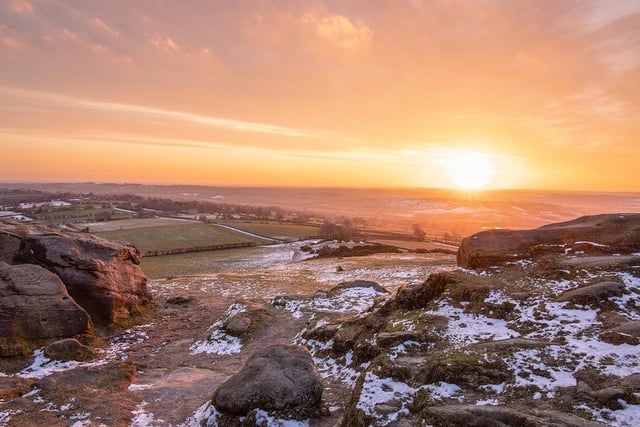 Almscliffe Crag is located near Harrogate. The photograph was taken looking down, with a frosty sunrise reflecting those rare colours to the sky.