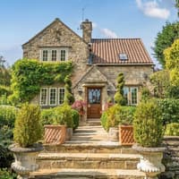 Inside this picture-perfect, high end home with stunning landscaped gardens