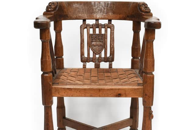 A Robert ‘Mouseman’ Thompson English Oak Monk’s Chair, with Coat of Arms for Ampleforth Abbey – estimate: £2,000-3,000