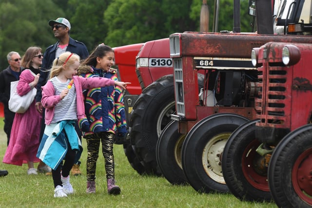Visitors of all ages enjoying the tractors on display at the festival