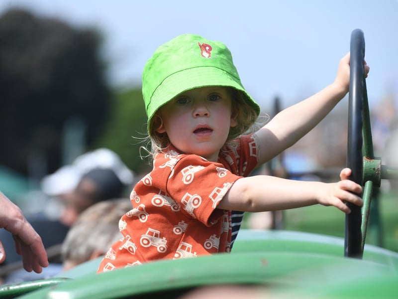 Caspan Willis (aged two) sat on a John Deere Tractor
