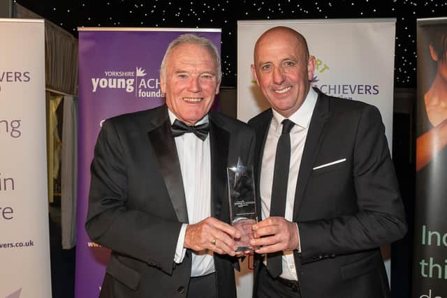 Yorkshire Young Achievers Awards - Leeds United legend Eddie Gray receives the Achievement in Sport Award on behalf of his son Archie from fellow Leeds and Scotland great Gary McAllister. (Picture contributed)
