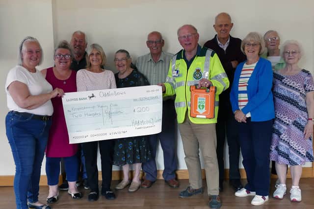 Donation for defibrillators -  Knaresborough Harmony Oddfellows group with Rotarian and First Responder Jonathan Beer holding a defibrillator. (Picture Knaresborough Rotary)
