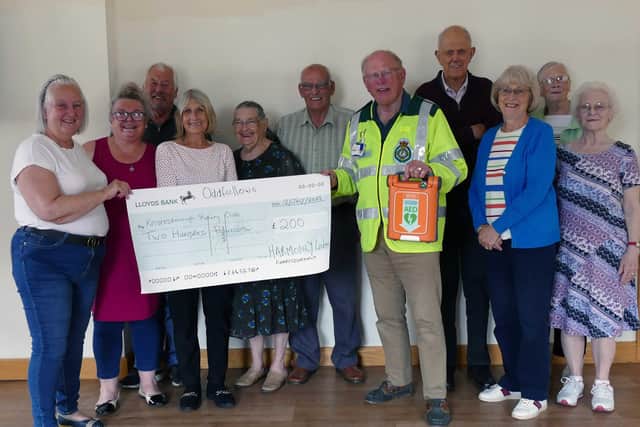 Donation for defibrillators - Knaresborough Harmony Oddfellows group with Rotarian and First Responder Jonathan Beer holding a defibrillator. (Picture Knaresborough Rotary)