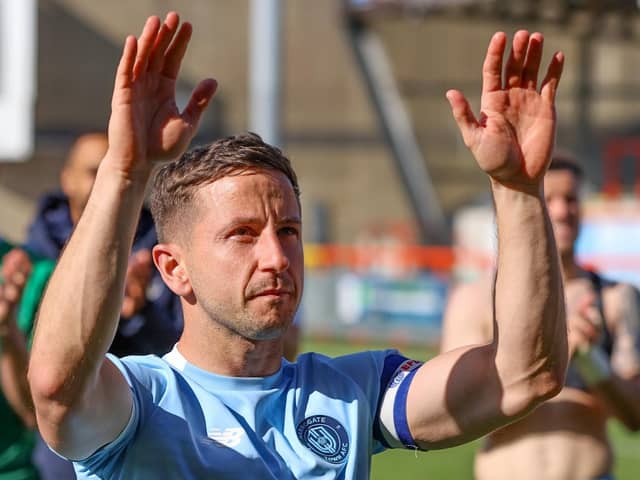 Josh Falkingham takes the applause of Harrogate Town's travelling fans following Saturday's 2-1 win at Morecambe. Pictures: Matt Kirkham