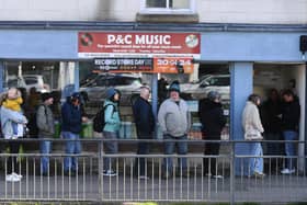 People waiting on the pavement outside P&C Music shop in Harrogate on Saturday before doors opened at 8am for Record Store Day 2024. (Picture Gerard Binks)