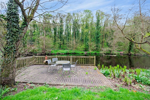 A decked area on which to sit or entertain, and lookout over the River Nidd.