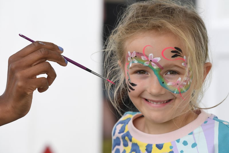 Isla Davies (aged six) having her face painted at the festival