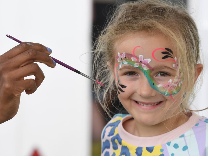 Isla Davies (aged six) having her face painted at the festival