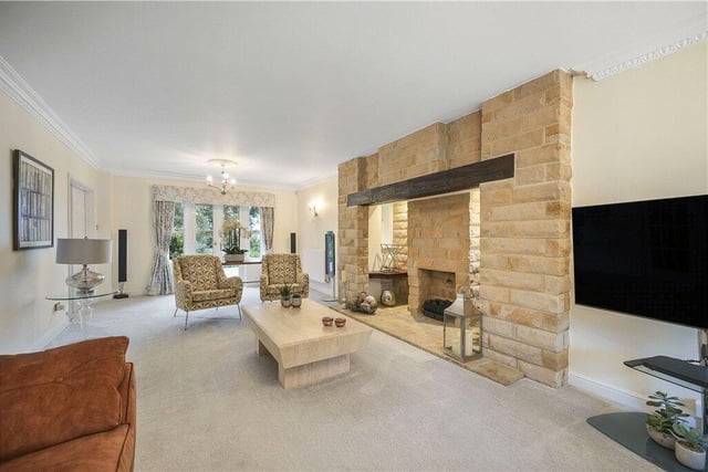 A large, stone, inglenook-style fireplace with a living flame gas fire is a central feature of the lounge, that has French doors to the garden.