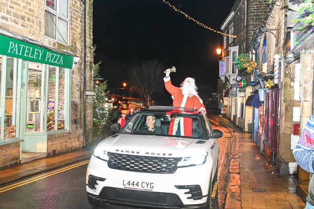 Santa Claus paraded the high street in a Range Rover - a modern day sleigh.