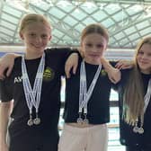 Harrogate swimmers, from left, Amelia Wright, Lois Child, Nell Carter and Lily Stansfield won silver medals in two age 13-14 relay races at the Long Course County Championships. Picture: Submitted