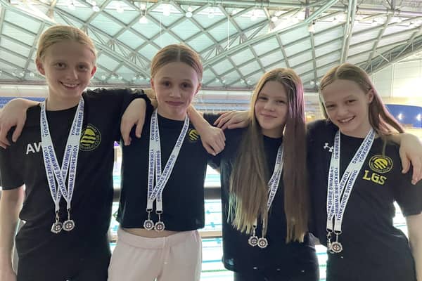 Harrogate swimmers, from left, Amelia Wright, Lois Child, Nell Carter and Lily Stansfield won silver medals in two age 13-14 relay races at the Long Course County Championships. Picture: Submitted