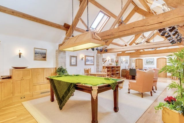 A living space for visitors and independent relatives  is connected to the manor house by a substantial two story barn.