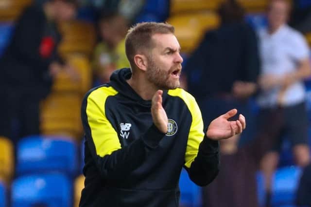 Harrogate Town manager Simon Weaver urges his players on during Saturday's 3-2 League Two defeat at AFC Wimbledon. Pictures: Matt Kirkham