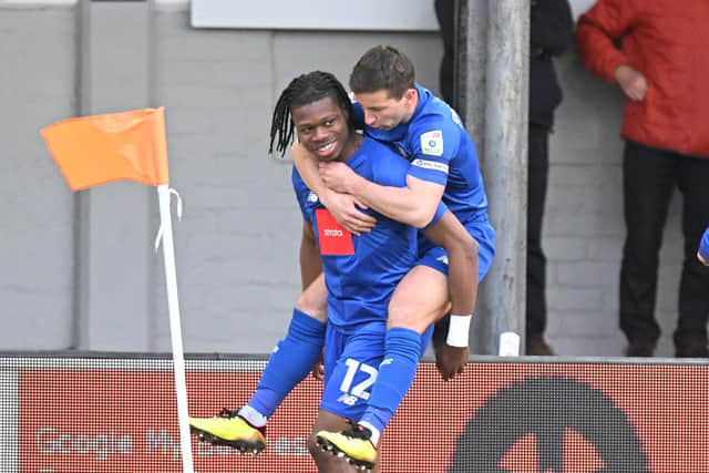Sam Folarin is congratulated by captain Josh Falkingham after bagging the Sulphurites' fifth-minute equaliser at Rodney Parade.