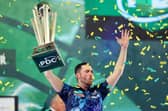 TROPHY PARADE - Luke Humphries lifts the trophy after winning the 2023/24 Paddy Power World Darts Championship final against Luke Littler. Humphries will parade his trophy at Elland Road when Leeds United host Preston North End on Sunday. Pic: Tom Dulat/Getty Images)