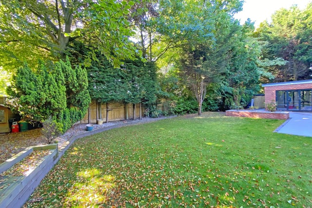This property has a rear paved garden, with garden room, and an extensive lawned area with patio is bordered with flowers and shrubs.