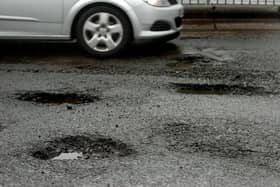 An example of potholes on our roads - but what are the rules which apply to local authorities if damage or injury is caused?