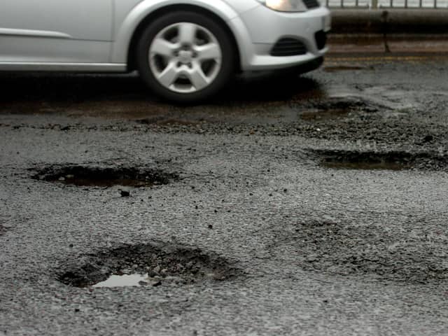 An example of potholes on our roads - but what are the rules which apply to local authorities if damage or injury is caused?