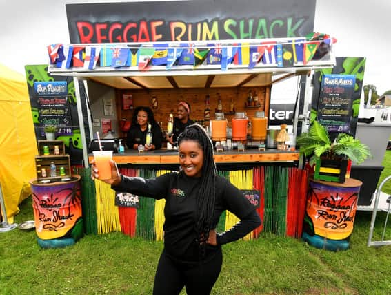The Riverside Food Festival, Wetherby. Cherrelle Davis (front) with Natasha Lewis and Saffia Morris from the Reggae Rum Shack Leeds, pictured at the festival.Picture taken by Yorkshire Post Photographer Simon Hulme 5th August 2023