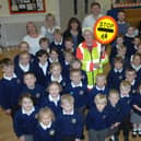 Mary Fisher with youngsters and staff members at Summerbridge Primary School