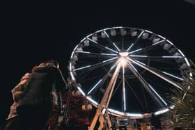 Festive season is here - Harrogate's giant ferris wheel lit up at night at Cheltenham Crescent.